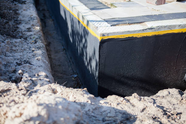Professional Waterproofing technician working in Woodville, WI